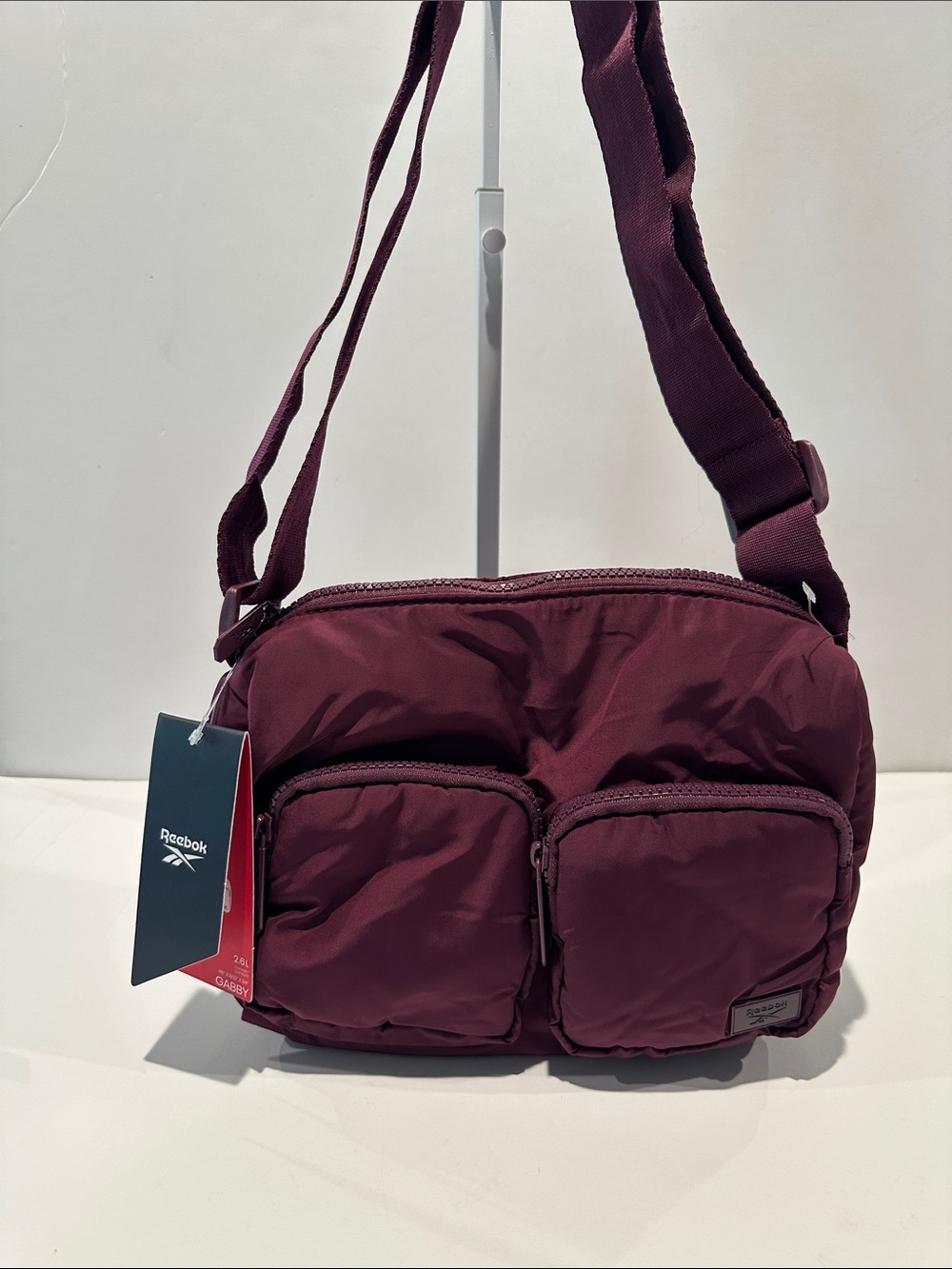 NWT Reebok Ladies Grape Wine Crossbody Bag w/zipper front pockets and adj. strap